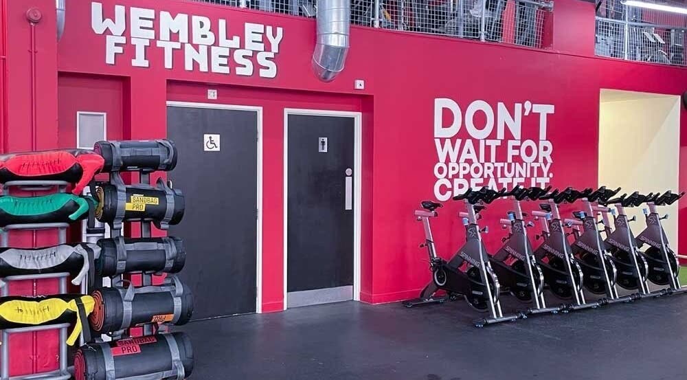 Interior of Wembley Fitness in Wembley, England, GB showing stationary bikes and workout equipment.