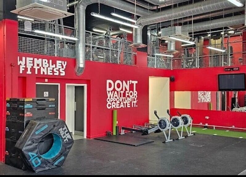 Wembley Fitness gym interior with equipment in Wembley, England, GB, emphasizing a motivational quote.