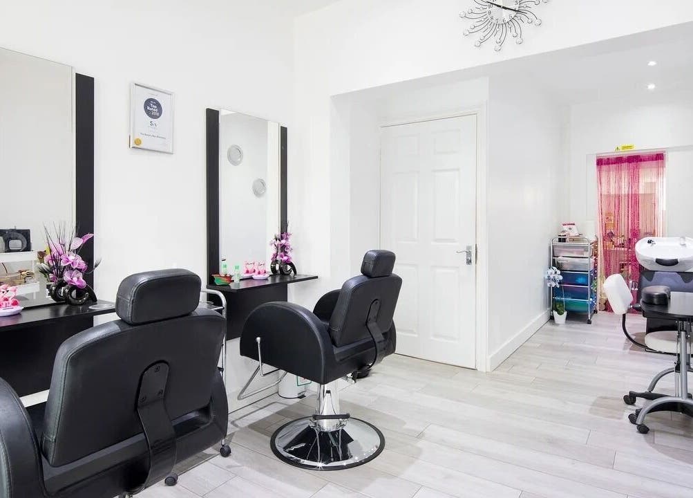 Chic salon at The Beauty Bar Wembley, featuring plush black chairs in Wembley, England, GB.