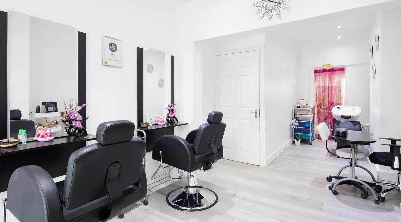 Chic salon at The Beauty Bar Wembley, featuring plush black chairs in Wembley, England, GB.