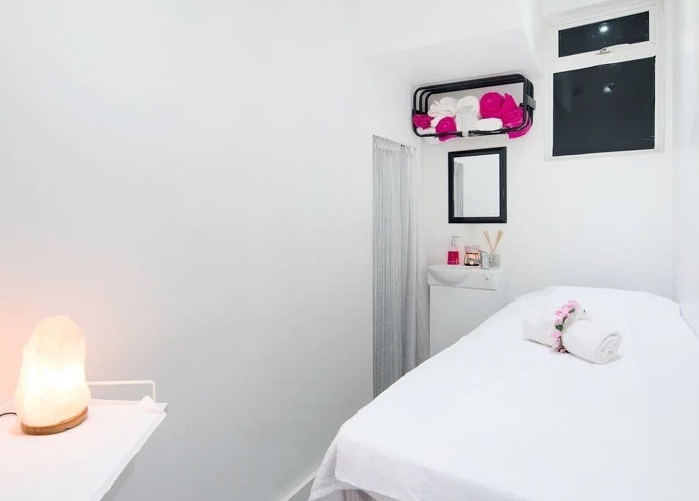 Relaxing treatment room at The Beauty Bar Wembley, Wembley, England, GB, featuring a cozy massage table.