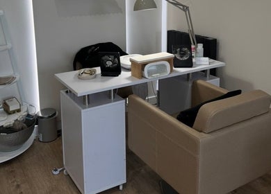 Modern nail station at Freyasbeautybar, Caterham, England, GB, with cozy seating and stylish decor.