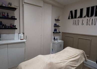 Elegant treatment room at Freyasbeautybar in Caterham, England, GB, with modern decor and beauty products displayed.