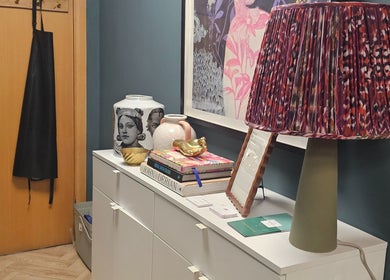 Artistic salon decor at Jolie Hairdressing, London, England, GB, featuring stylish lamp and elegant vases.