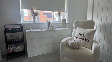 Ab.aesthetics cozy beauty room with plush chair and decor in Clifton Upon Dunsmore, England, GB.