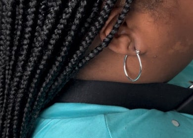 Close-up of stylish braids at Serenity Stylez Braidz Bar in Spring, Texas, US.