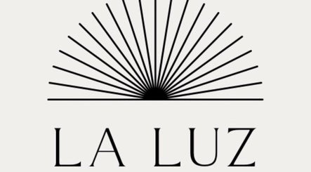 Logo of La Luz Beauty Studio, located in Saint Michael, BB, featuring a sunburst design.