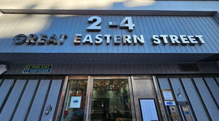 Entrance of Tokyo Nailya at 2-4 Great Eastern Street, London, England, GB with modern metal signage.
