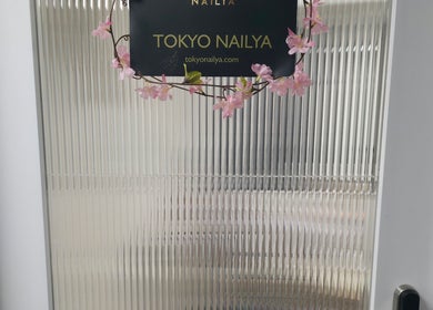 Entrance sign of Tokyo Nailya with floral decor, located in London, England, GB.
