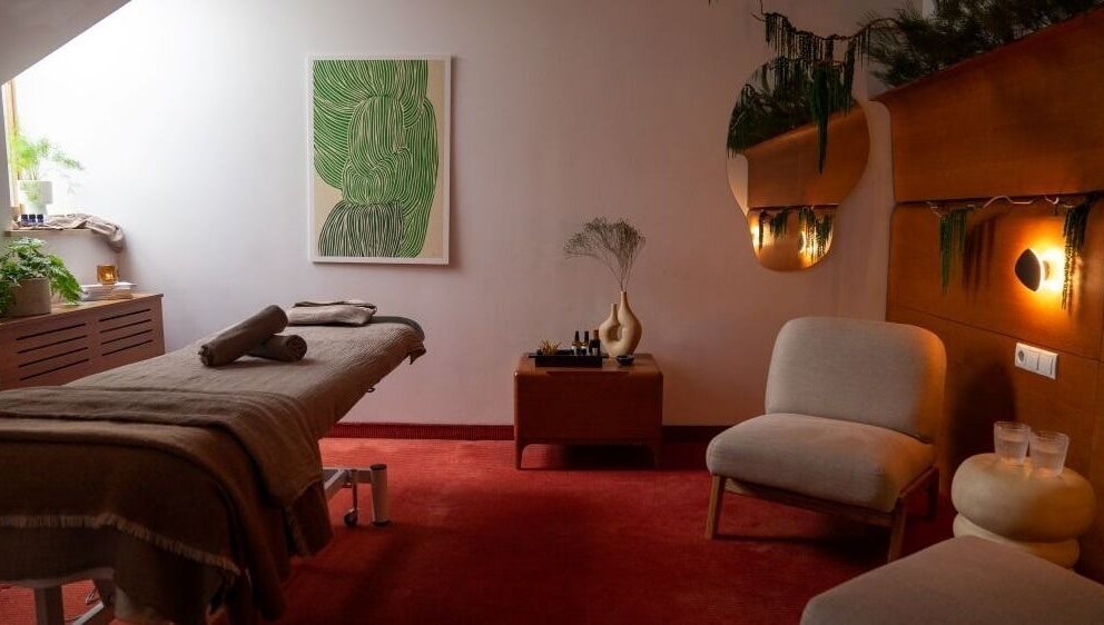 Cozy massage room at Sitgajos masažas in Vilnius, Vilniaus Apskritis, LT with a comfortable table and warm lighting.