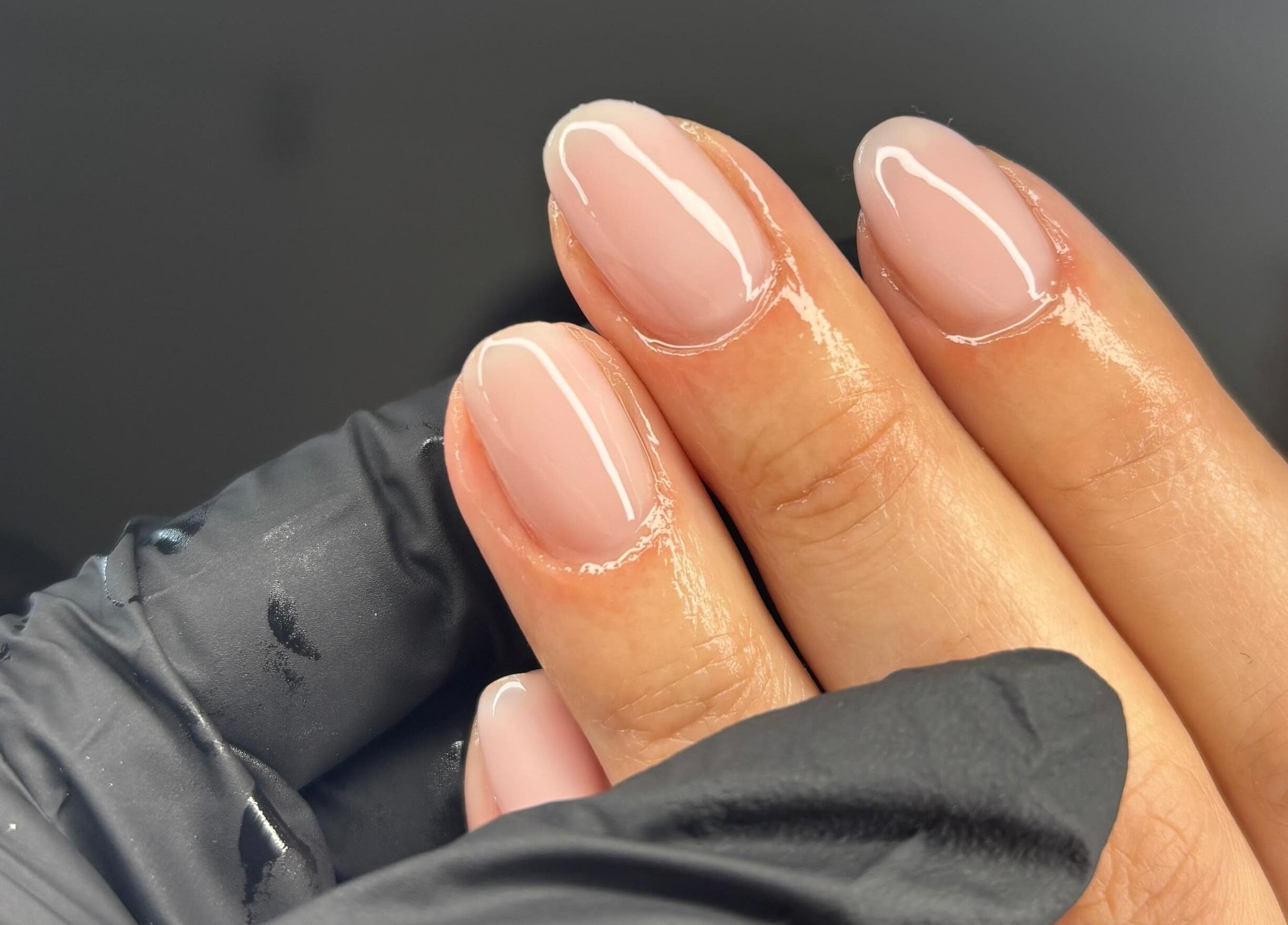 Close-up of manicured nails with glossy finish at NF Artistry, Cape Town, Western Cape, ZA.
