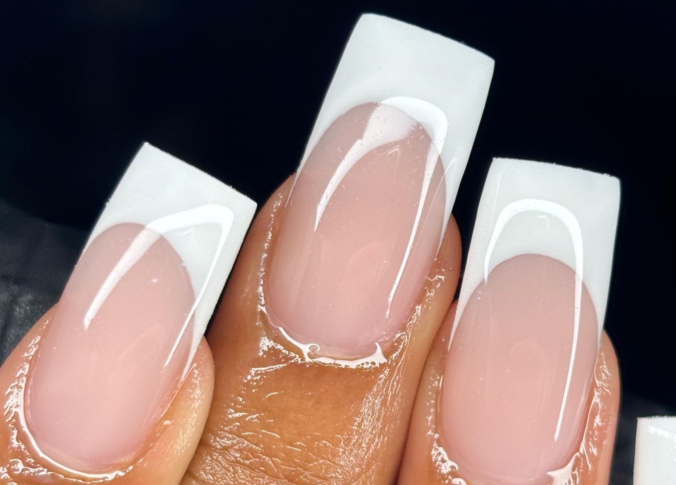 Close-up of stylish French manicure at NF Artistry in Cape Town, Western Cape, ZA.