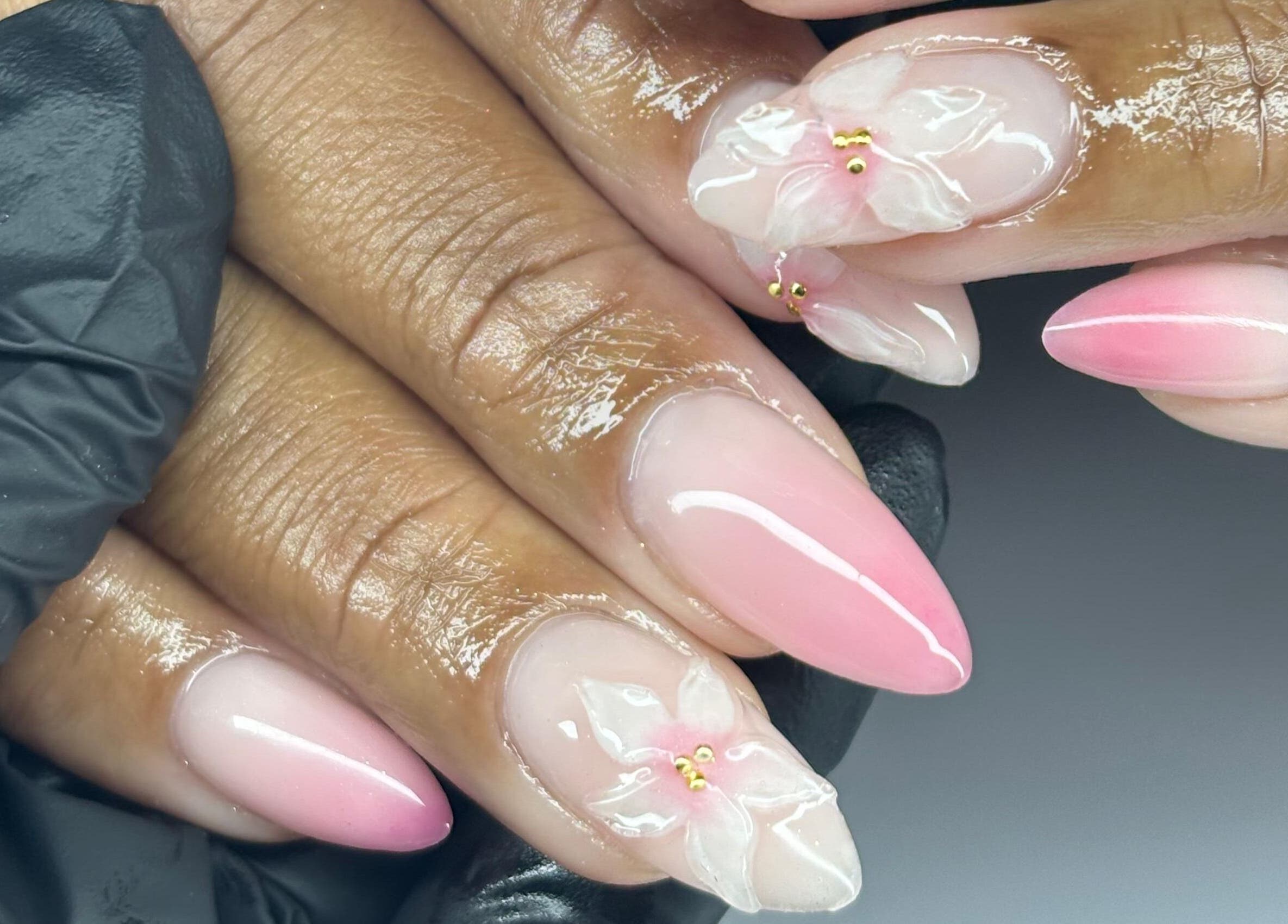 Elegant floral nail design by NF Artistry in Cape Town, Western Cape, ZA. Glossy pink finish with delicate details.