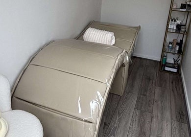 Relaxing treatment room at The Luxe Lounge Lash & Brows, Cardiff, Wales, GB with plush furnishings.