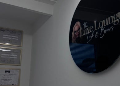 Certificates and sign at The Luxe Lounge Lash & Brows, Cardiff, Wales, GB, showcasing expertise.