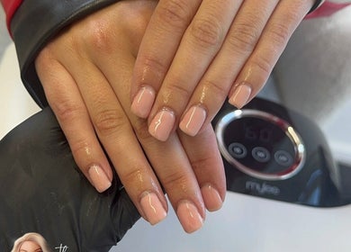 Glossy nude nails at The Luxe Lounge Lash & Brows, Cardiff, Wales, GB, showcasing elegance and precision.