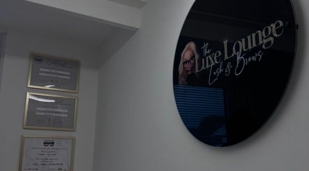 The Luxe Lounge Lash & Brows venue wall sign and certificates in Cardiff, Wales, GB.