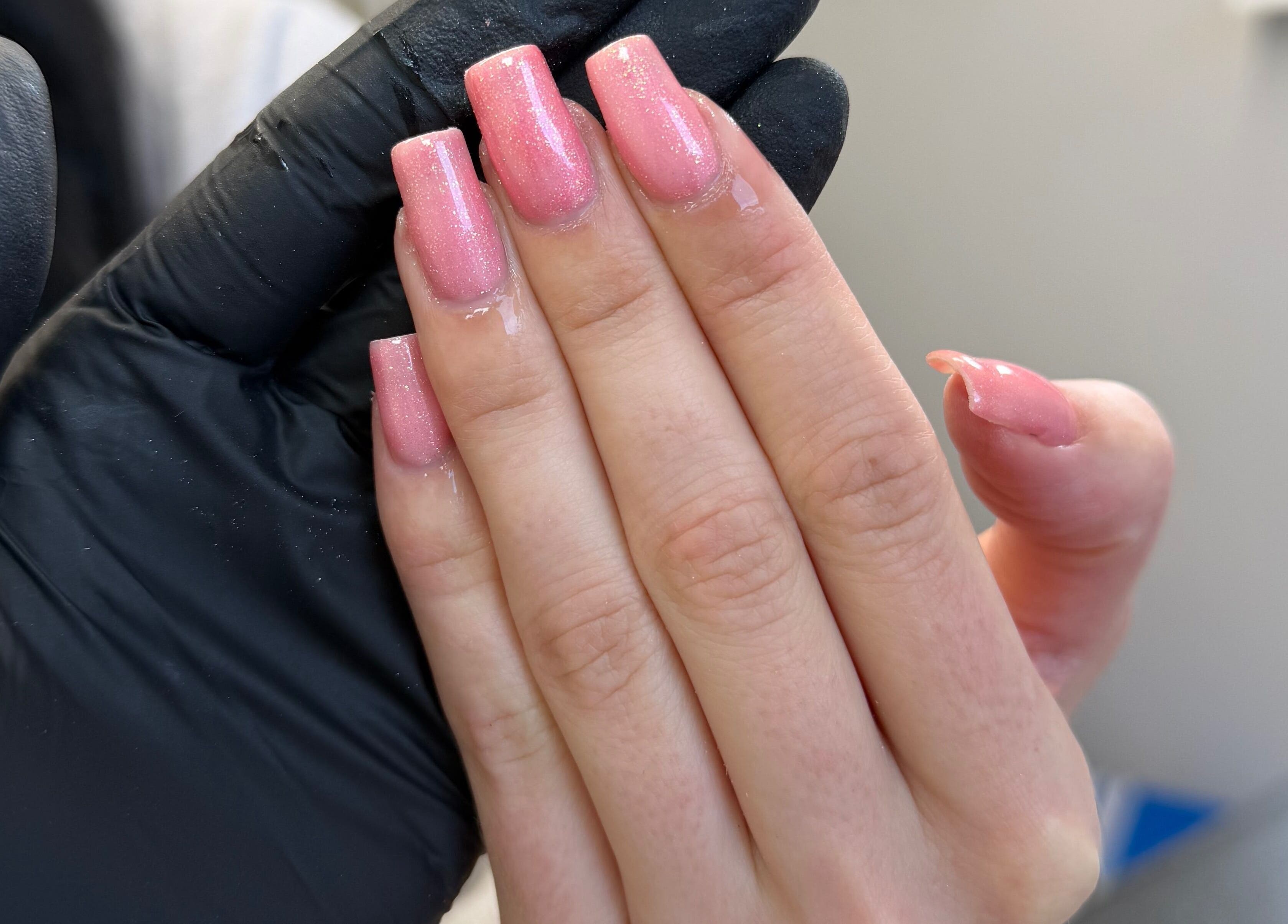 Glossy pink nails at The Luxe Lounge Lash & Brows, Cardiff, Wales, GB. Perfect nail care and style.