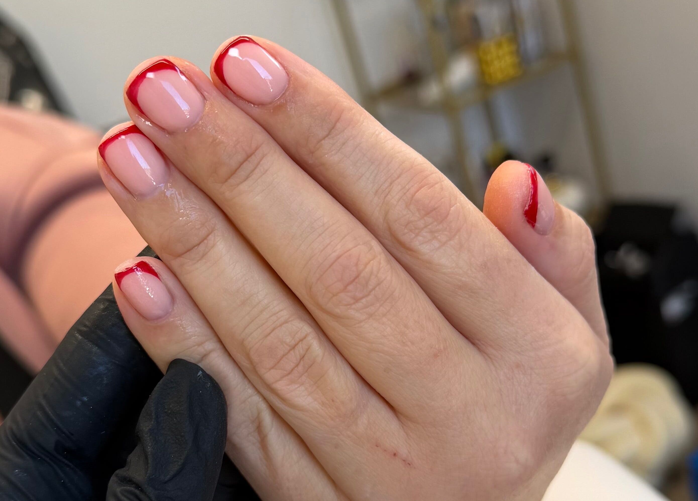 Elegant red-tipped manicure at The Luxe Lounge Lash & Brows, Cardiff, Wales, GB.