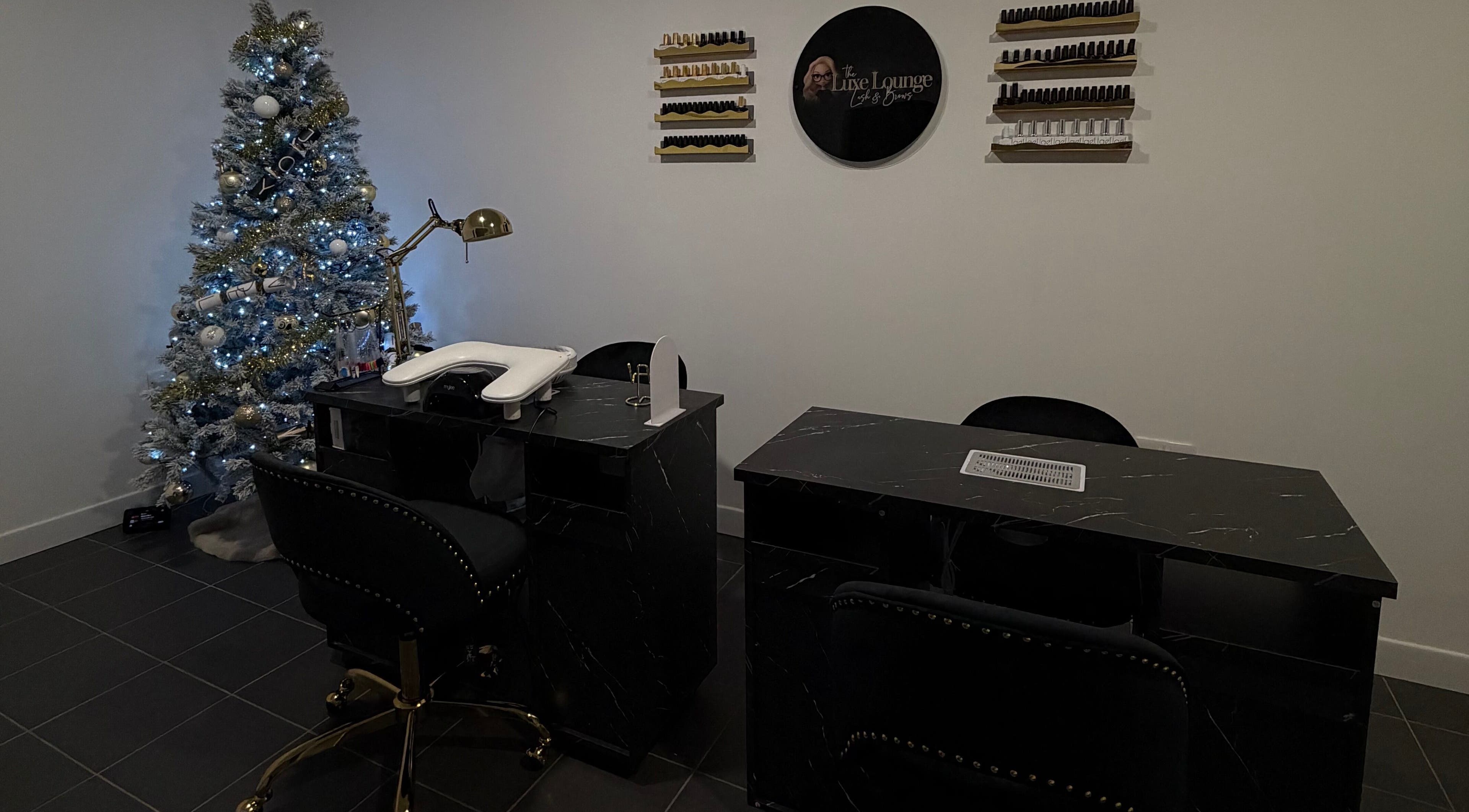 Elegant nail station at The Luxe Lounge Lash & Brows, Cardiff, Wales, GB with festive decor.