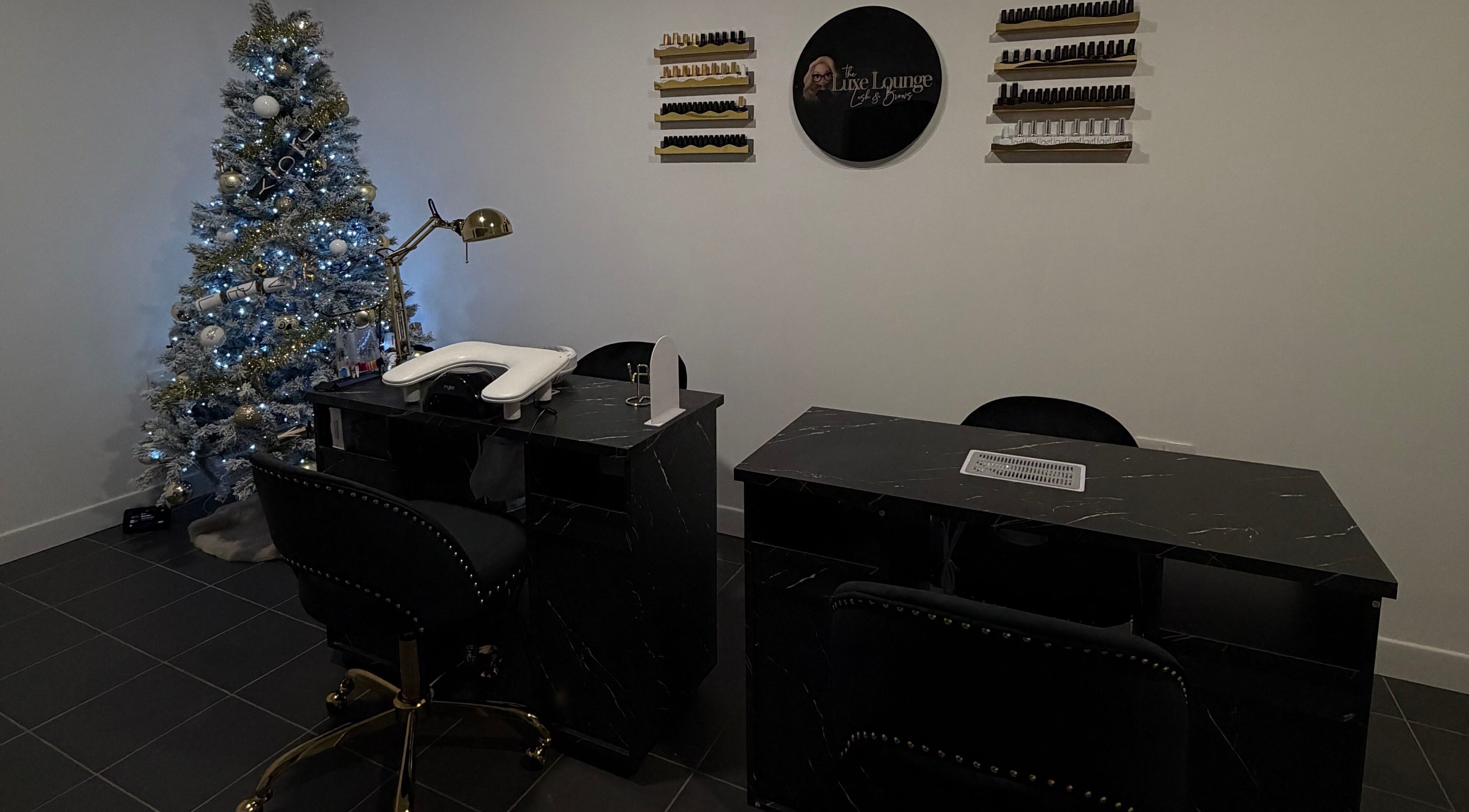 Elegant nail station at The Luxe Lounge Lash & Brows, Cardiff, Wales, GB with festive decor.