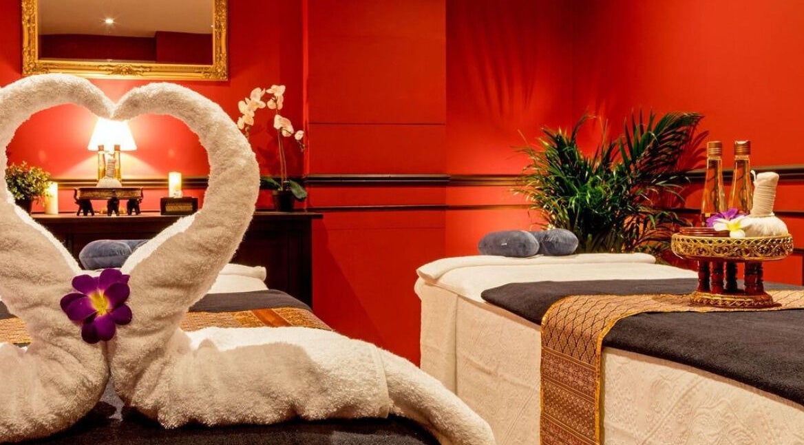Elegant treatment room at Kanburi Thai Spa, London, England, GB, featuring plush towels and ambient lighting.