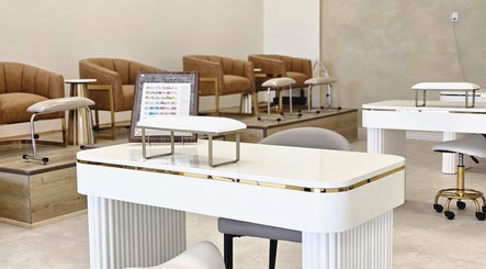 Elegant nail salon setup at Honey Bunny, St. Catharines, Ontario, CA with seating and polish display.