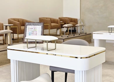 Chic nail salon interior at Honey Bunny, St. Catharines, Ontario, CA, featuring luxurious massage chairs.