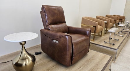 Luxurious leather chair at Honey Bunny, St. Catharines, Ontario, CA, offering ultimate comfort and relaxation.