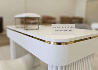 Sanitized spa table at Honey Bunny in St. Catharines, Ontario, CA with single-use tools for hygiene.