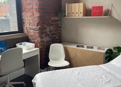 Modern treatment room at Transfigure Medical Aesthetics, Stockport, England, GB with stylish decor.