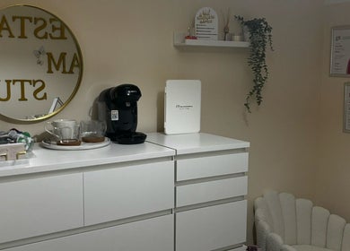 Elegant beauty station at By.vestajonkute salon, Liverpool, England, GB, featuring decor and refreshments.