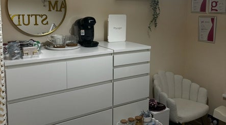 Cozy beauty corner at By.vestajonkute in Liverpool, England, GB with modern white drawers and comfortable chair.