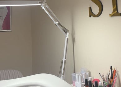 Elegant nail studio setup at By.vestajonkute, Liverpool, England, GB showcasing modern tools and decor.