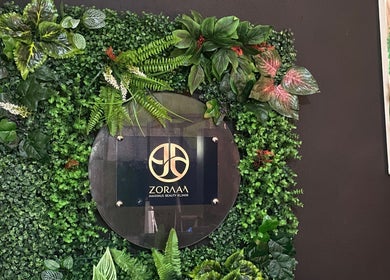 Zoraaa Maximus Beauty Klinik signage surrounded by lush greenery, located in Knockpatrick, Manchester Parish, JM.