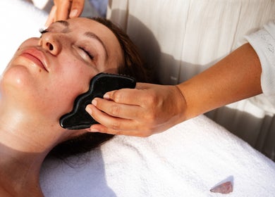 Gua Sha facial treatment at LGHTTouch in Philadelphia, Pennsylvania, US. Relaxing wellness experience.