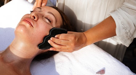 Gua Sha facial treatment at LGHTTouch in Philadelphia, Pennsylvania, US. Relaxing wellness experience.