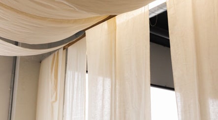 Elegant drapes hanging at LGHTTouch, creating a serene ambiance in Philadelphia, Pennsylvania, US.