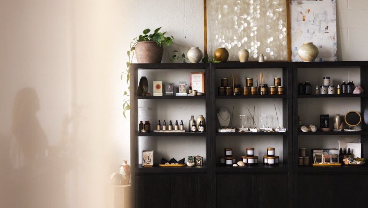 Elegant wellness shelves at LGHTTouch in Philadelphia, Pennsylvania, US, displaying natural beauty products.