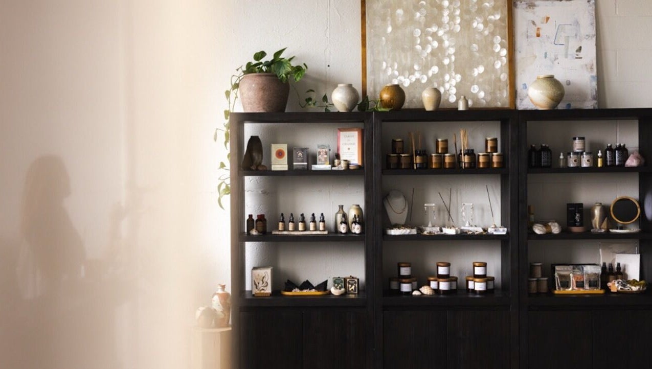 Elegant wellness shelves at LGHTTouch in Philadelphia, Pennsylvania, US, displaying natural beauty products.
