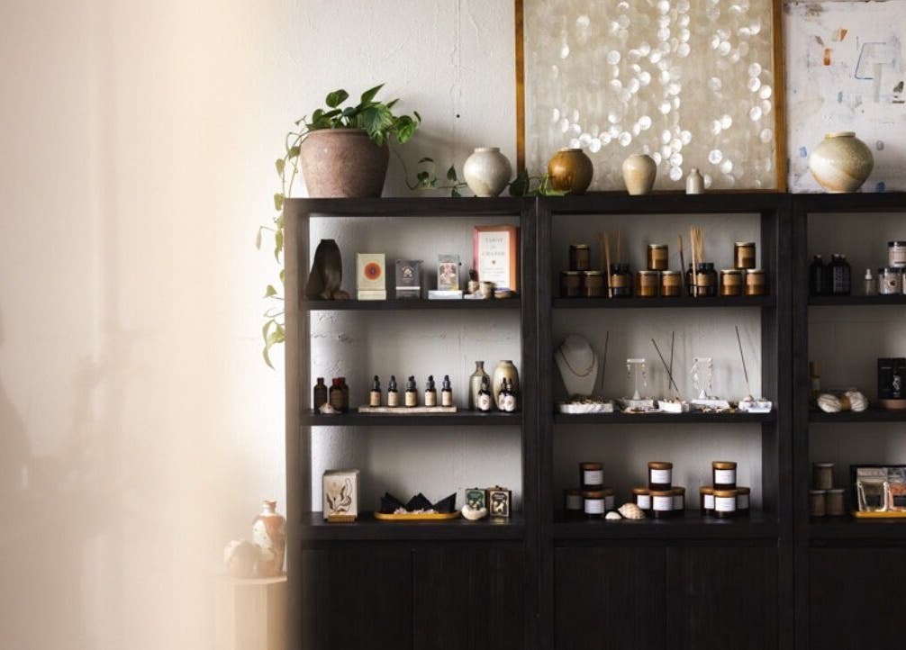 Elegant wellness shelves at LGHTTouch in Philadelphia, Pennsylvania, US, displaying natural beauty products.