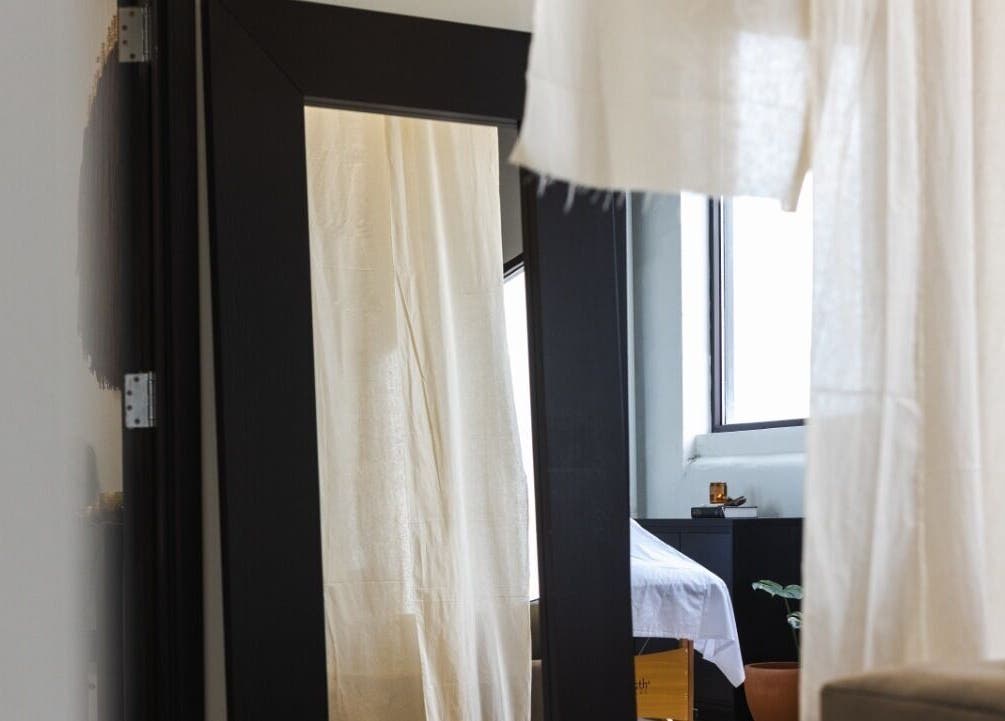 Tranquil interior of LGHTTouch in Philadelphia, Pennsylvania, with natural light and soft curtains.