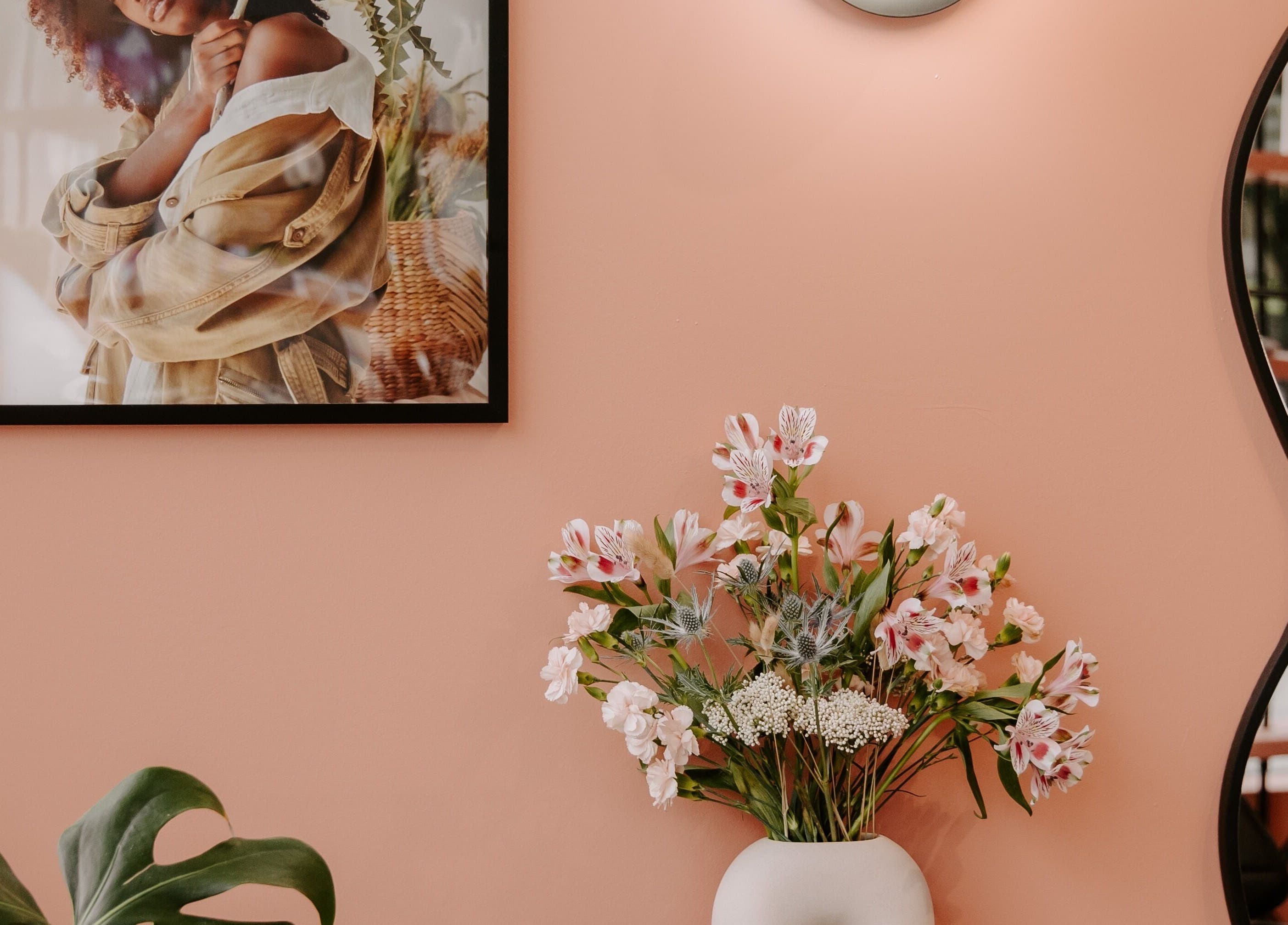 Stylish decor at LGHTTouch Pop-Up at Wash~Day, Philadelphia, Pennsylvania, US with pink wall and floral vase.