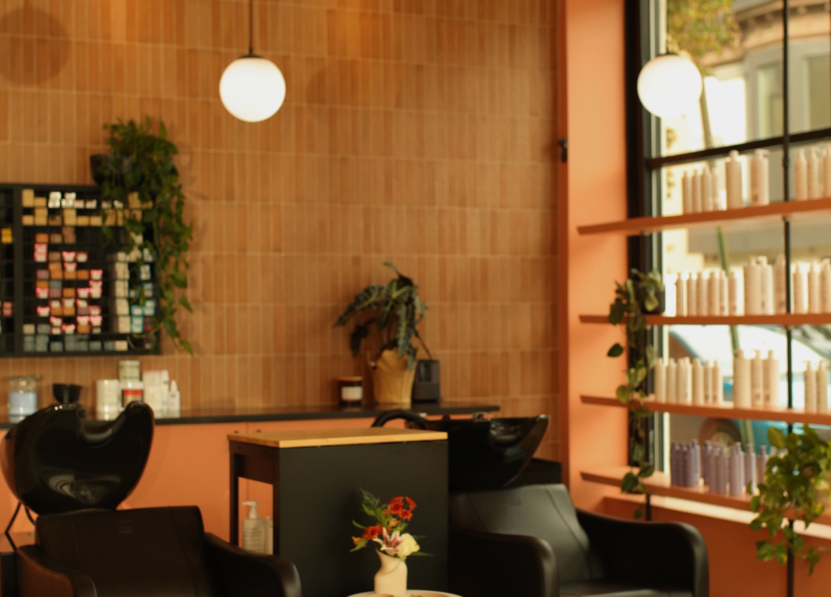 LGHTTouch Pop-Up at Wash~Day salon interior with seating and products in Philadelphia, Pennsylvania, US.