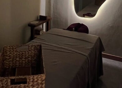 Tranquil massage room at The Zen Den Massage & Beauty Bali, Bali, ID with soothing ambient lighting.
