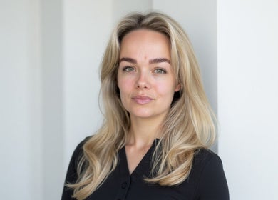 Smiling professional at SMP Aesthetics Kent, Royal Tunbridge Wells, England, GB, highlighting natural beauty.