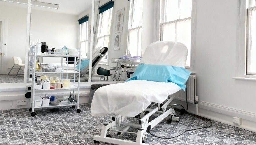 Bright treatment room at SMP Aesthetics Kent in Royal Tunbridge Wells, England, GB, ready for a session.