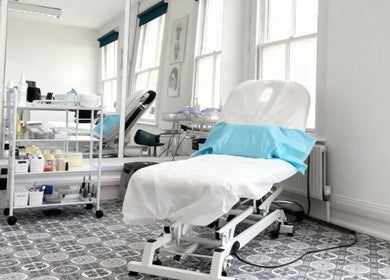 Bright treatment room at SMP Aesthetics Kent in Royal Tunbridge Wells, England, GB, ready for a session.