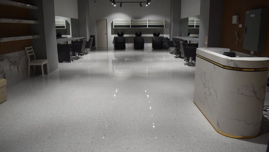 Lux Cuts N Colours salon in Bayswater, Victoria, AU. Modern, elegant interior with sleek styling stations.