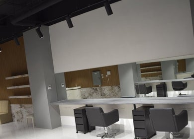 Modern salon interior at Lux Cuts N Colours, Bayswater, Victoria, AU showcasing sleek styling station and mirrors.